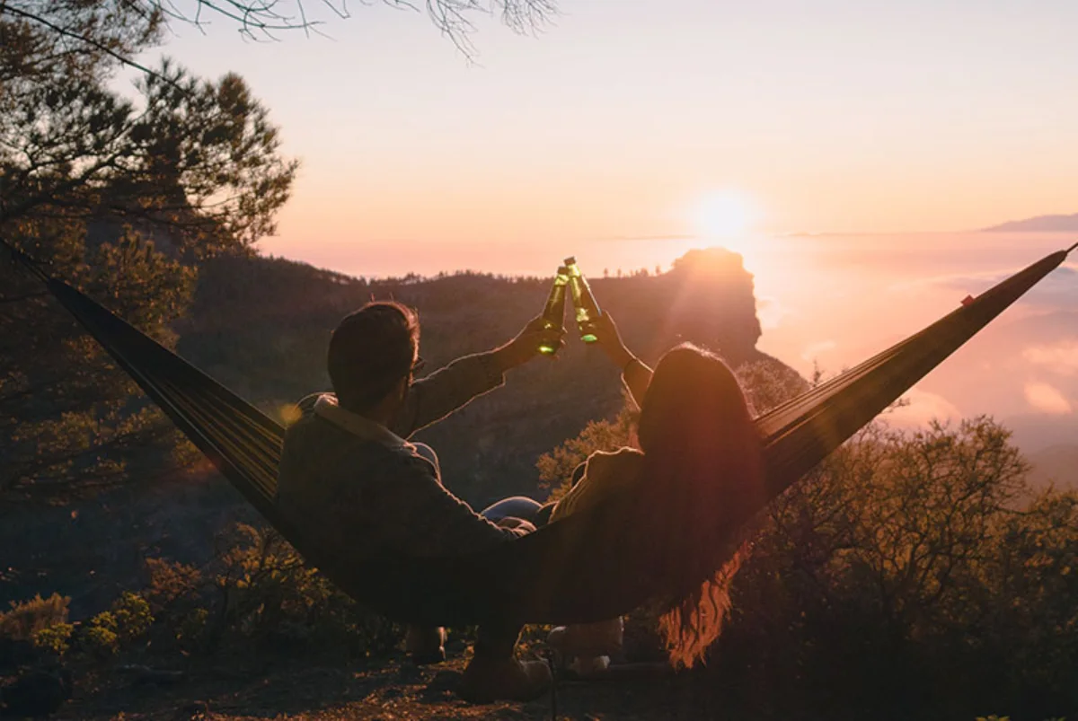 Date4you Review - a couple relaxing on a hammock with a beautiful view